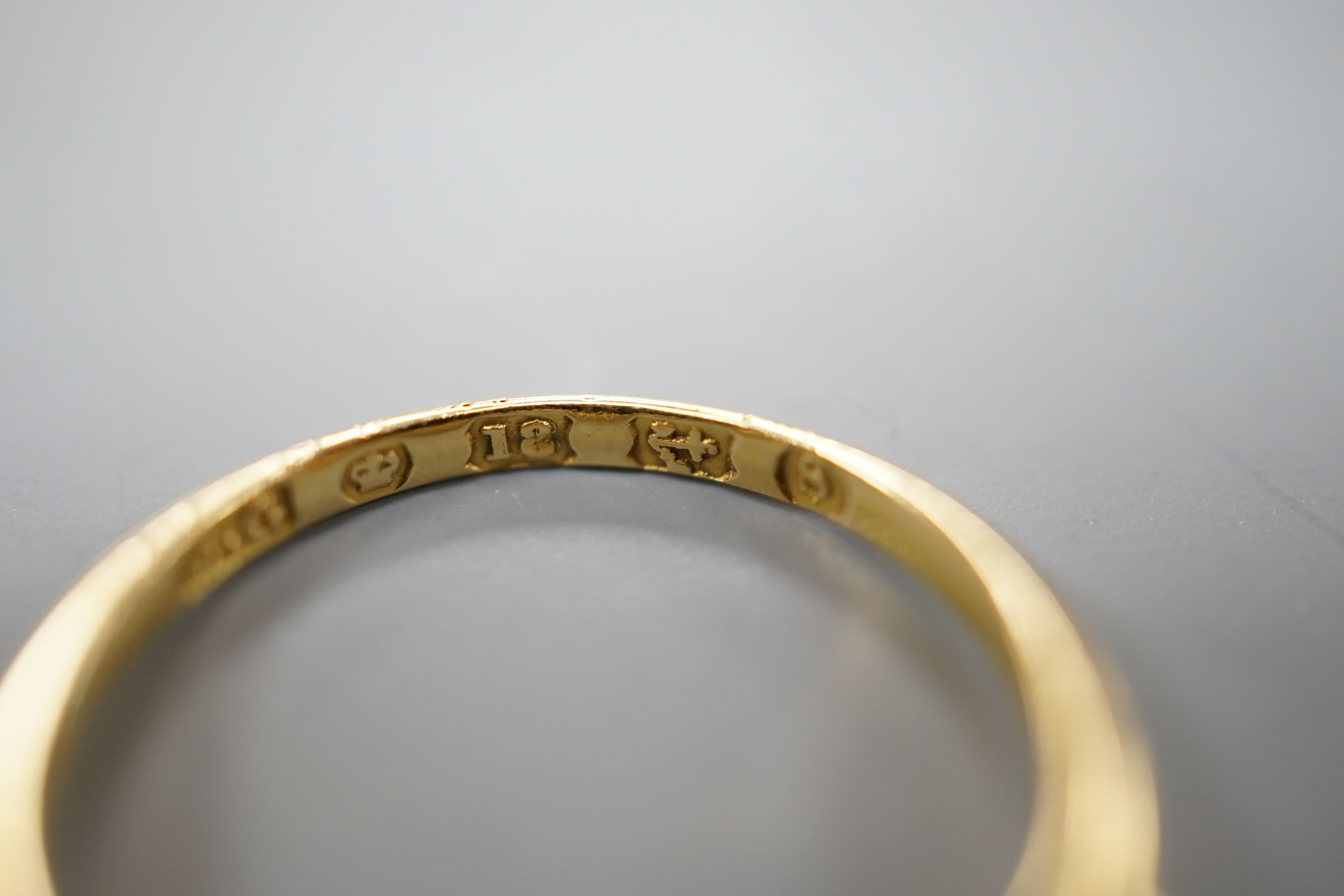 A George V 18ct gold, three stone emerald and four stone diamond chip set half hoop ring, size L, gross weight 1.8 grams.